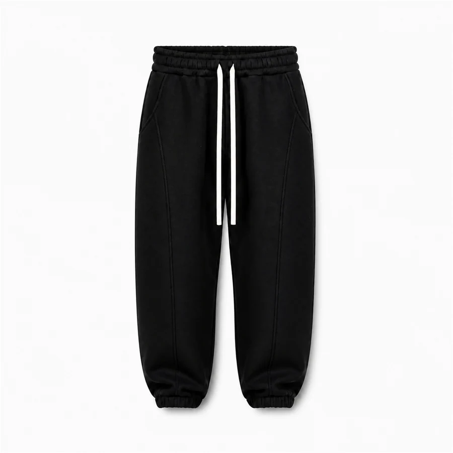 Pantaloni de trening bărbați negri balloon fit din bumbac; fotografie de catalog pentru compararea croielii.