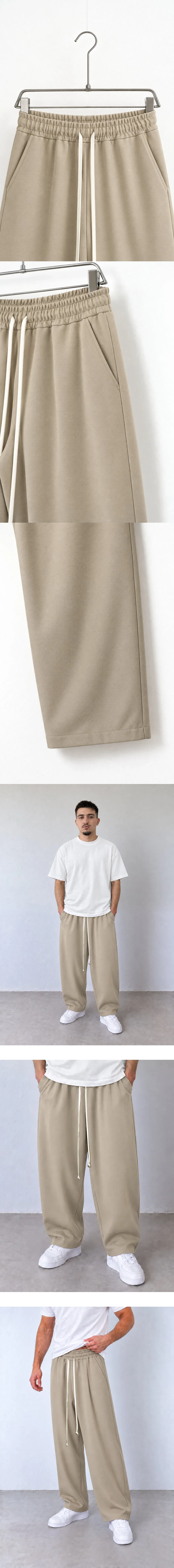 Pantaloni Bărbați Bej Baggy cu Cusături Frontale — detaliu talie elastică pantaloni pe umeraș — cadrul 2 din galeria editorială.