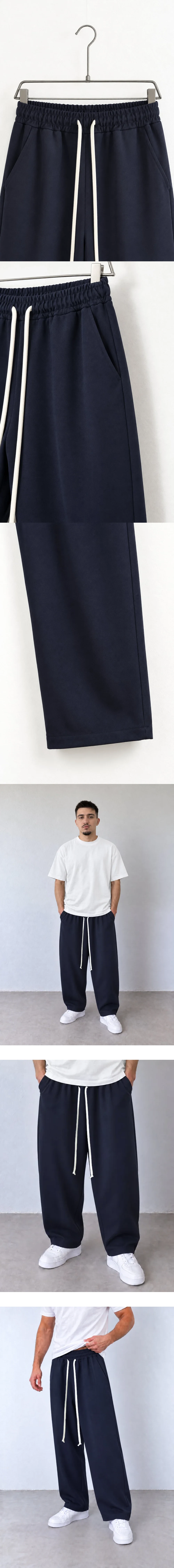 Pantaloni Bărbați Bleumarin Baggy cu Cusături Frontale — detaliu talie elastică pantaloni pe umeraș — cadrul 2 din galeria editorială.
