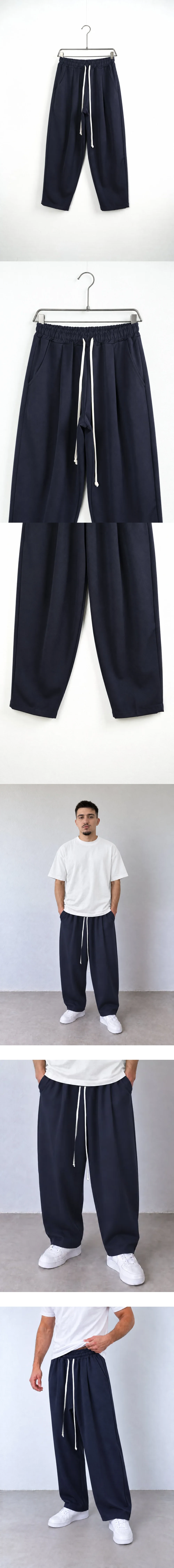 Pantaloni Bărbați Bleumarin Largi Baggy — pantaloni baggy pe umeraș, unghi oblic — cadrul 2 din galeria editorială.