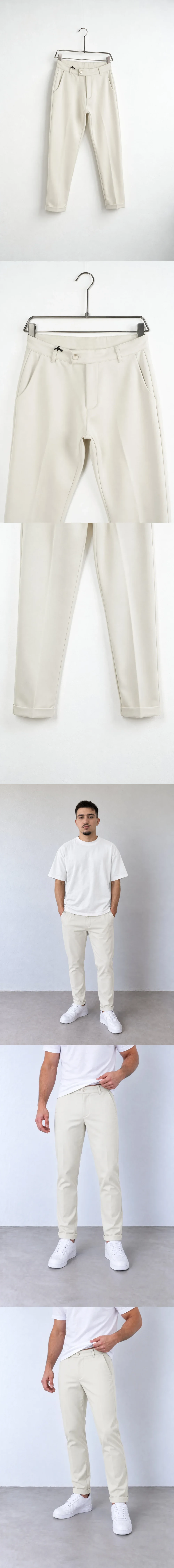 Pantaloni Bărbați Crem Slim Fit — pantaloni crem slim fit pe umeraș, vedere oblică — cadrul 2 din galeria editorială.