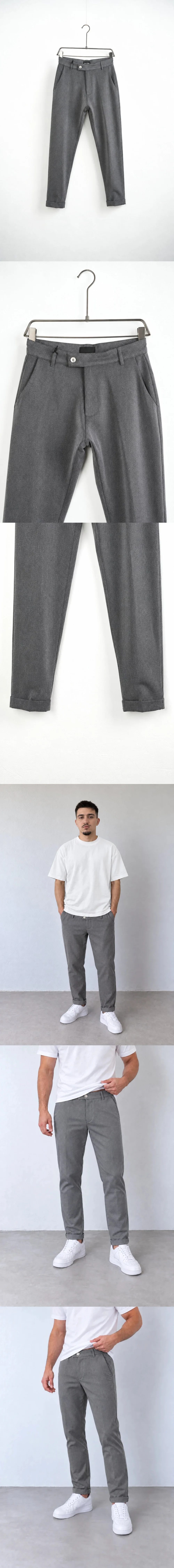 Pantaloni Bărbați Gri Slim Fit — pantaloni gri slim fit pe umeraș, vedere oblică — cadrul 2 din galeria editorială.