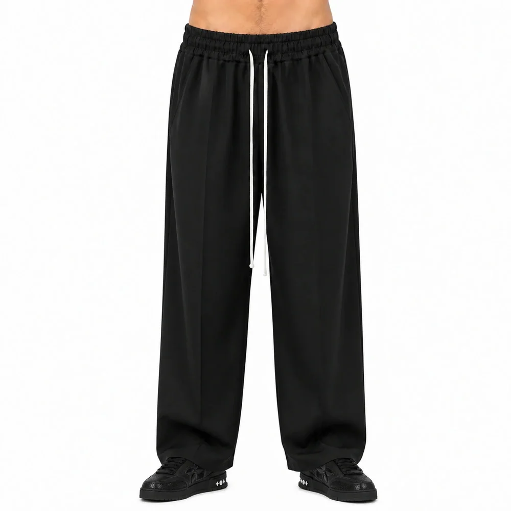 Pantaloni Wide Leg Bărbați Negri cu Șnur Lung — pantaloni wide leg bărbați negri, purtați de model, vedere frontală — cadrul 2 din galeria editorială.